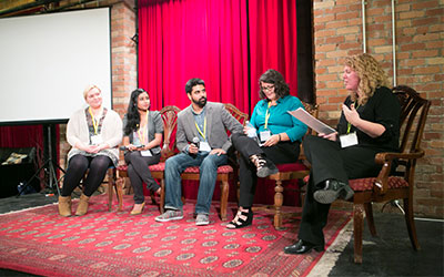 people sitting on stage