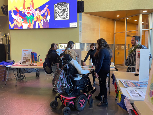 People talking at table at event