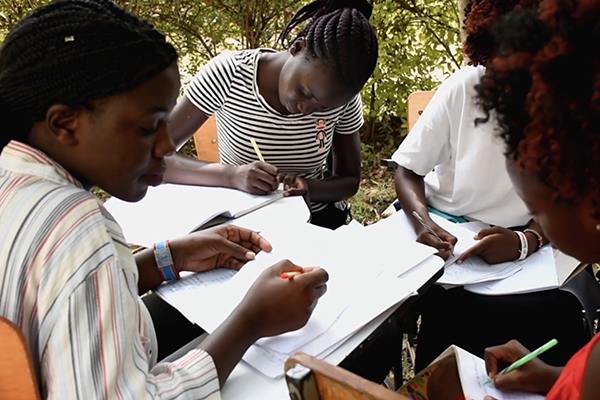 four female students working on a project